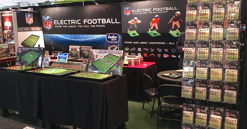 <img alt="Tudor Games Electric Football booth at the 2018 Toy Fair">