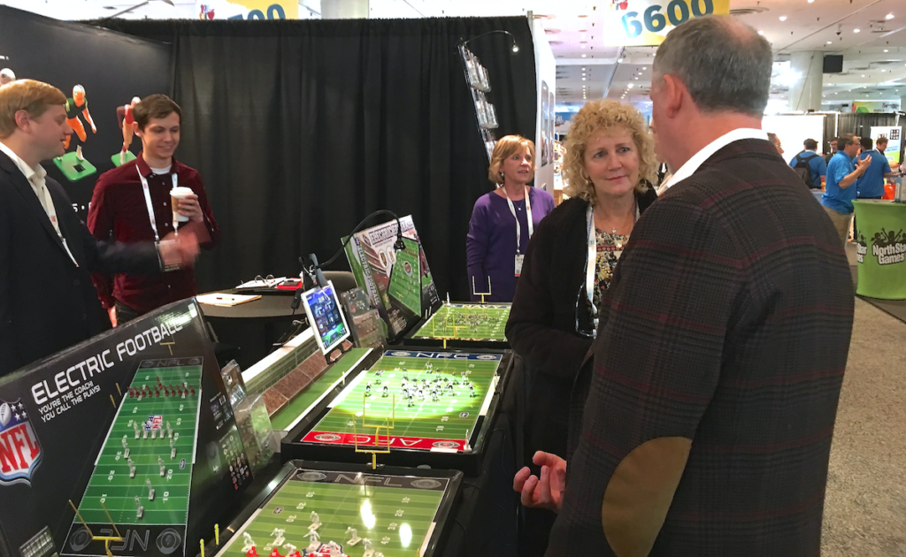 <img alt="Tudor NFL Electric Football Wendy Jones (Sas) Doug Strohm Family visits Tudor games Toy Fair 2018">